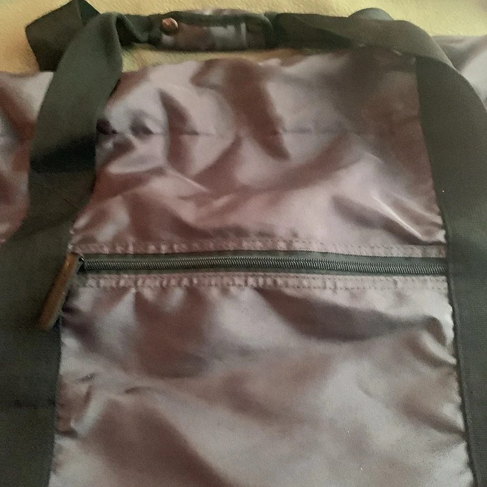 Dark gray and black nylon duffel bag. Approximately 27” x 15” x 11 1/2”